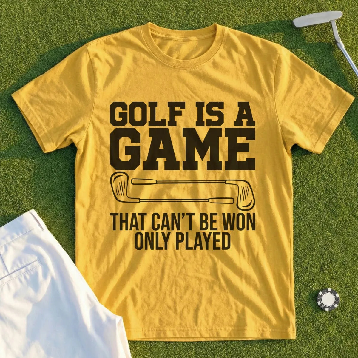 Yellow t-shirt with "GOLF IS A GAME THAT CAN'T BE WON ONLY PLAYED" text.