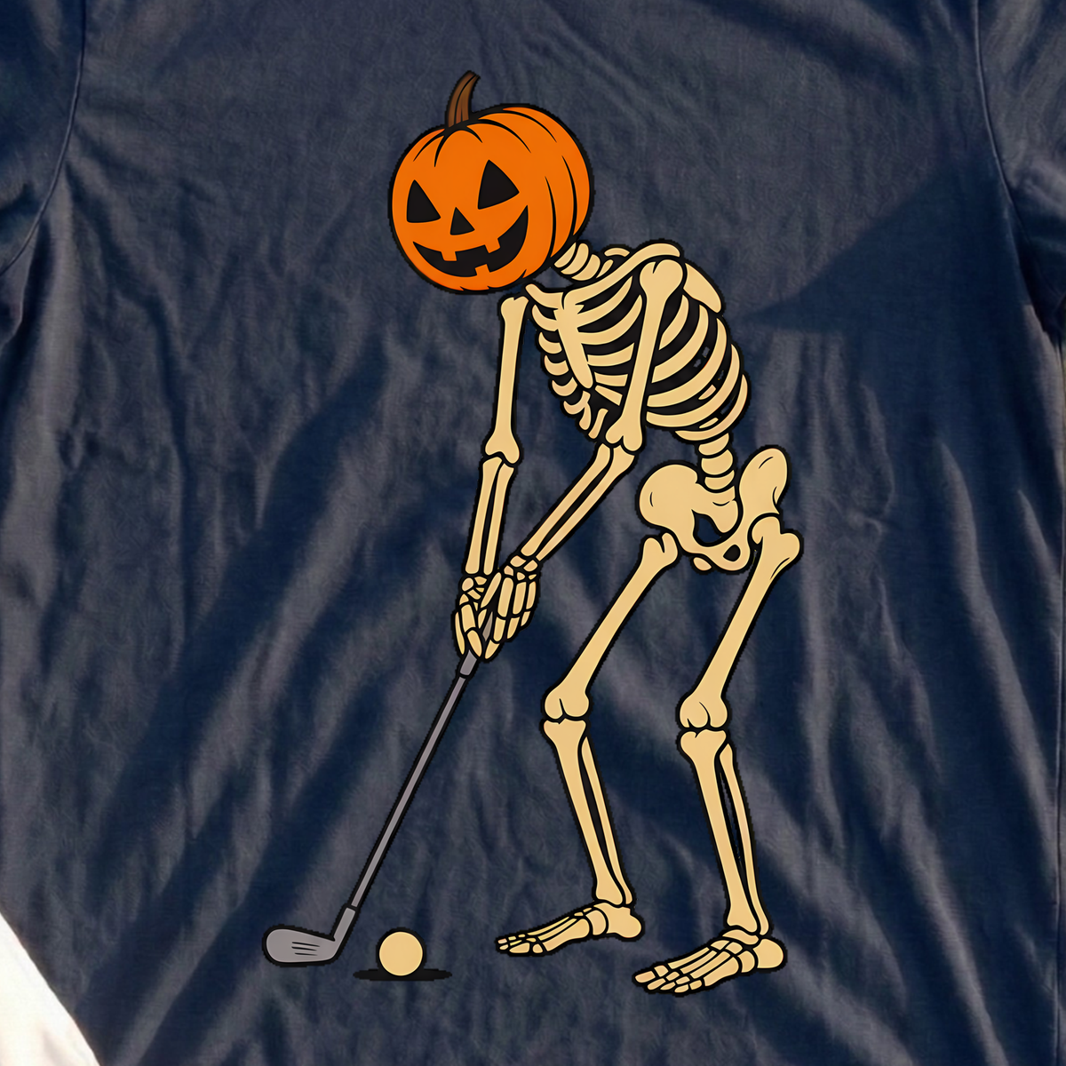 Pumpkin Head Putter Tee, print close-up on Navy