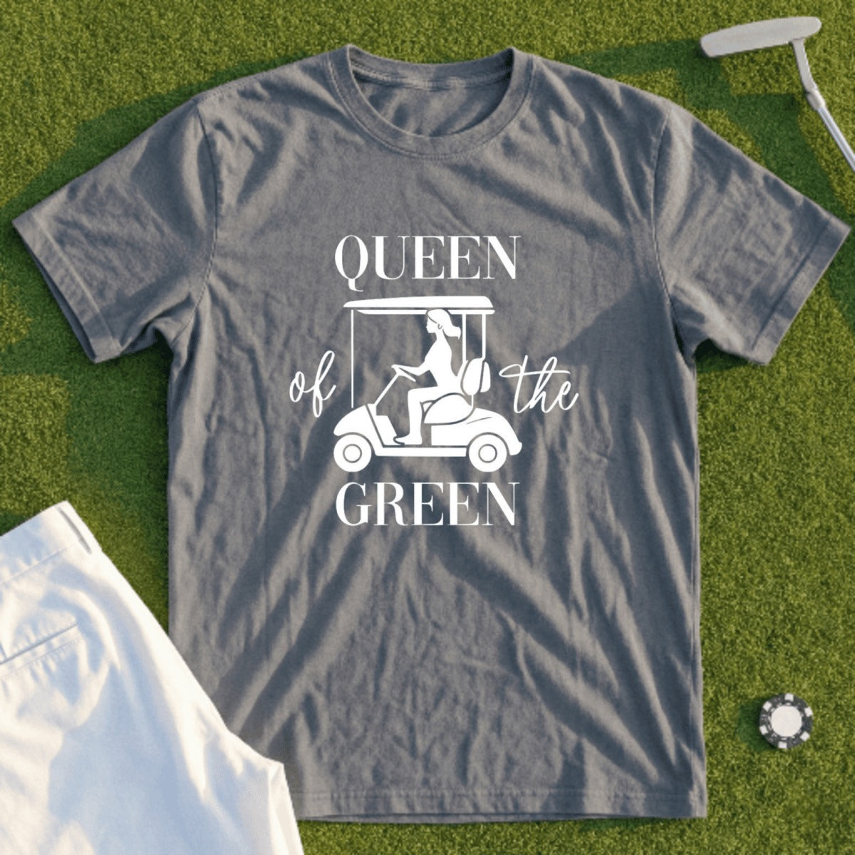 Queen of the Green graphic on a gray t-shirt with a golf cart illustration.