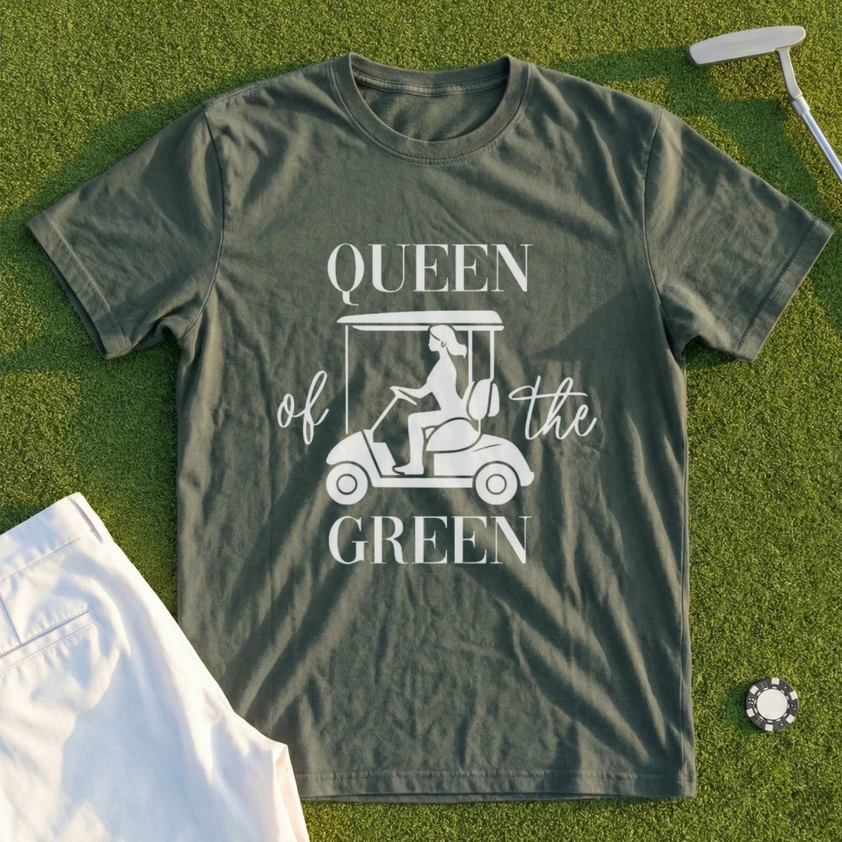 Olive green t-shirt with "Queen of the Green" text and golf cart graphic.