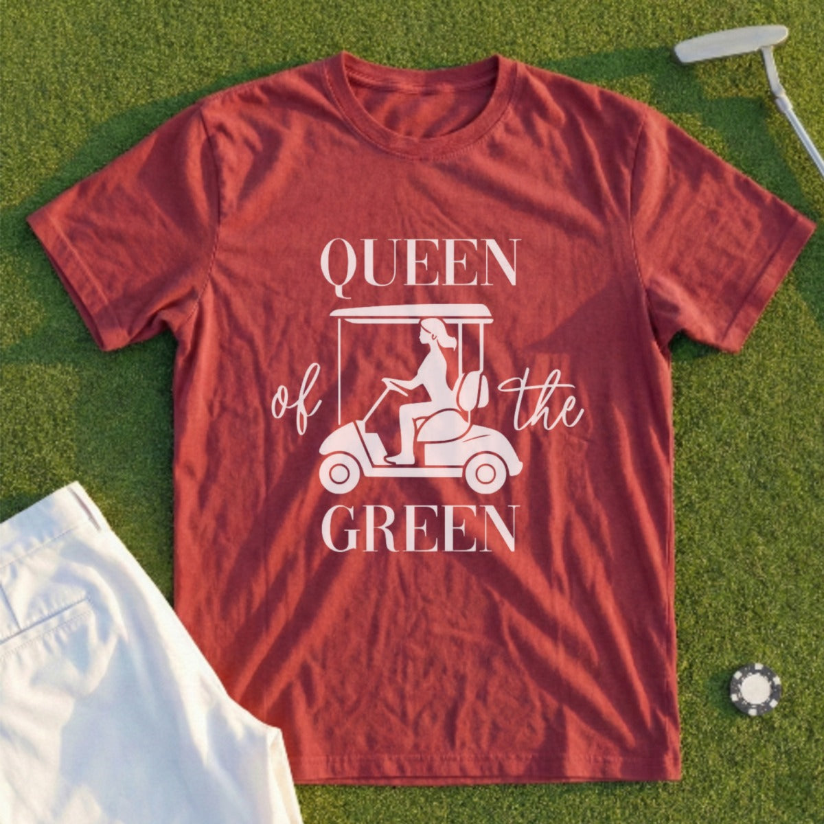 Maroon t-shirt with white text "Queen of the Green" and a golf cart graphic.