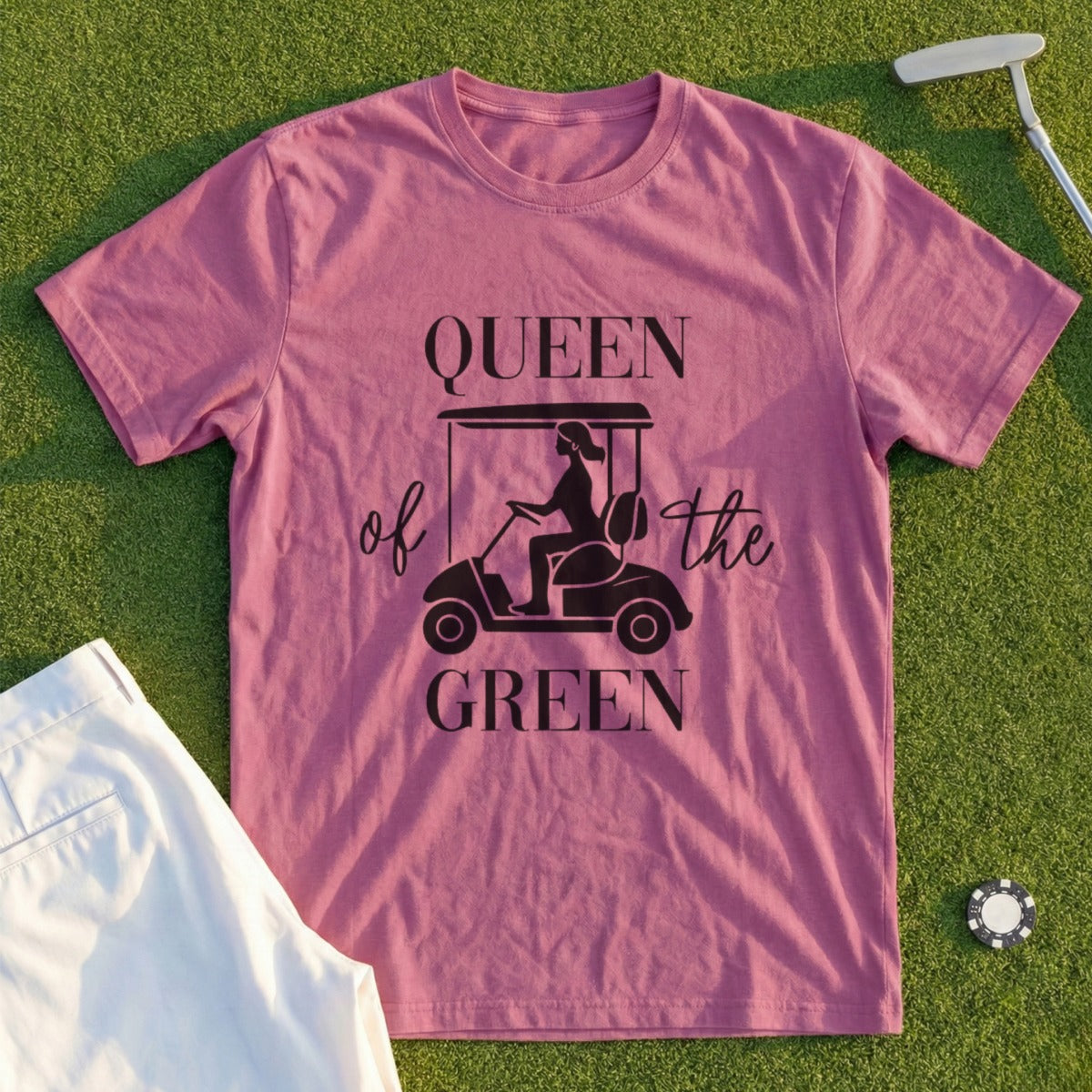 Queen of the Green t-shirt with golfer graphic and golf course background.