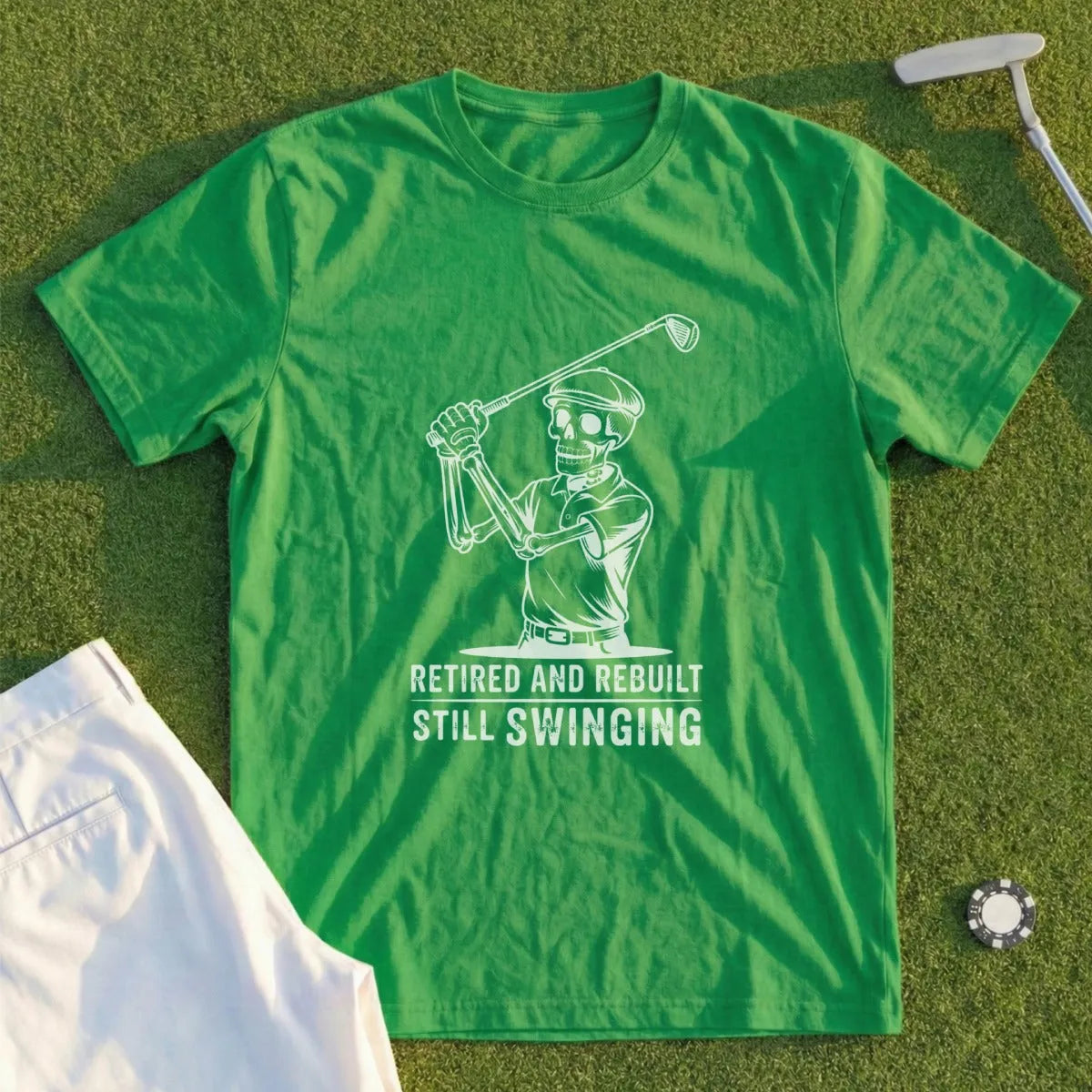 Green t-shirt with skeleton golfer graphic and text "Retired and Rebuilt Still Swinging".