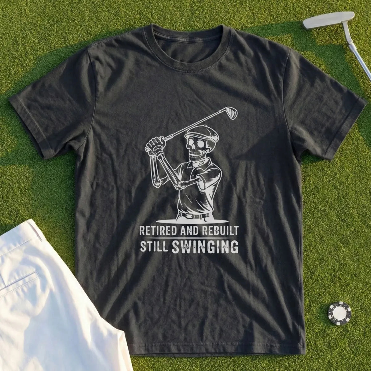 T-shirt with skeleton golfer graphic and text "Retired and Rebuilt Still Swinging".
