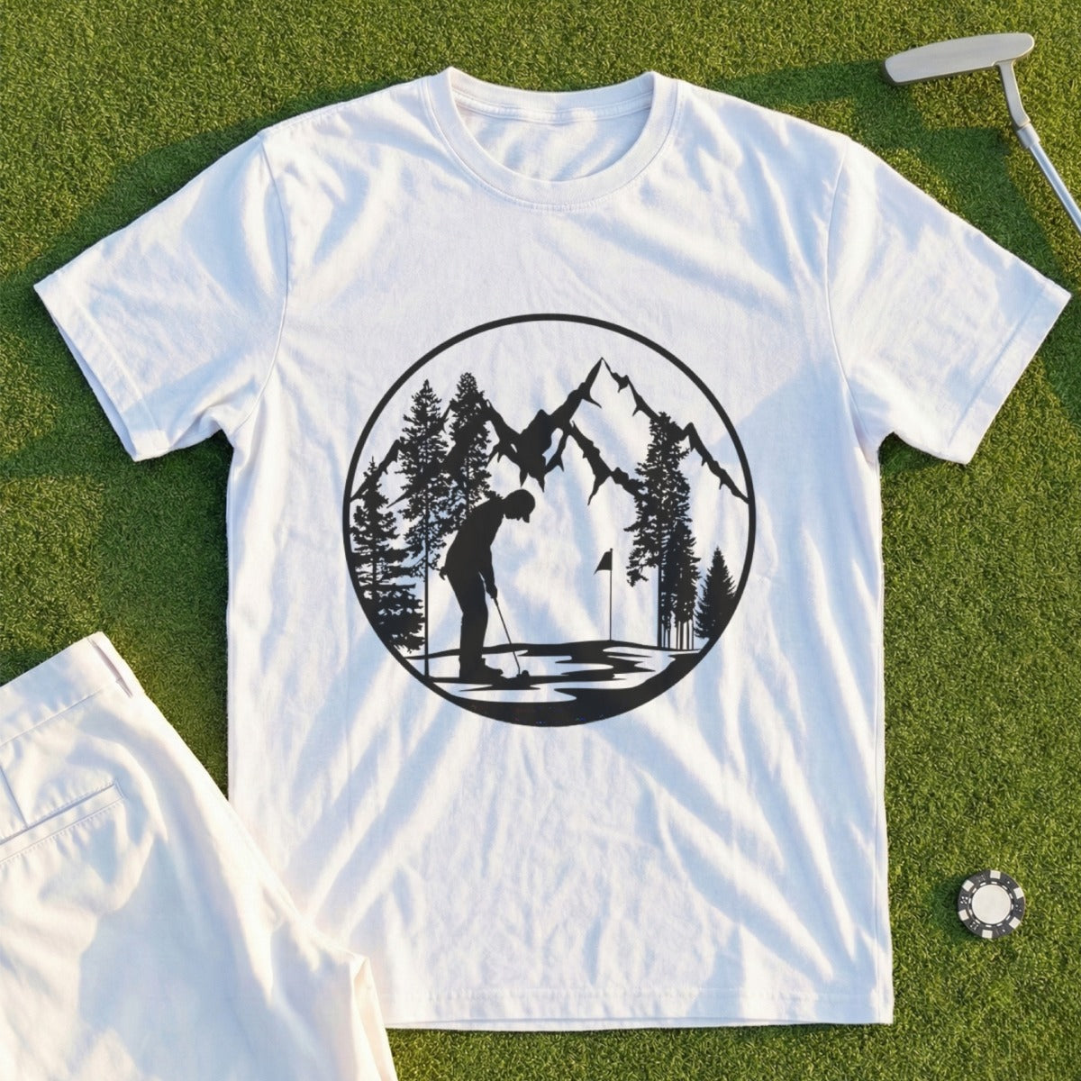 White t-shirt with a circular graphic of a golfer on a mountain course.