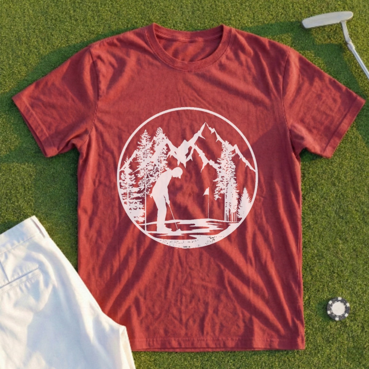 Maroon t-shirt with white circular graphic of a golfer and mountains.
