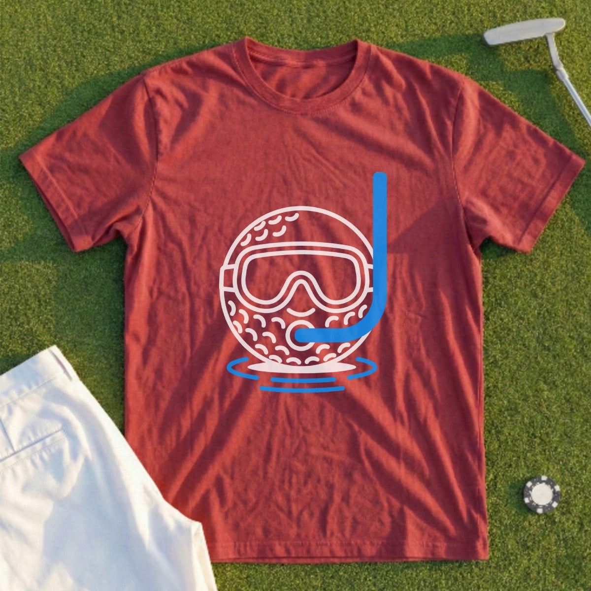 Red t-shirt with a graphic of a golf ball wearing a snorkel mask floating in water.