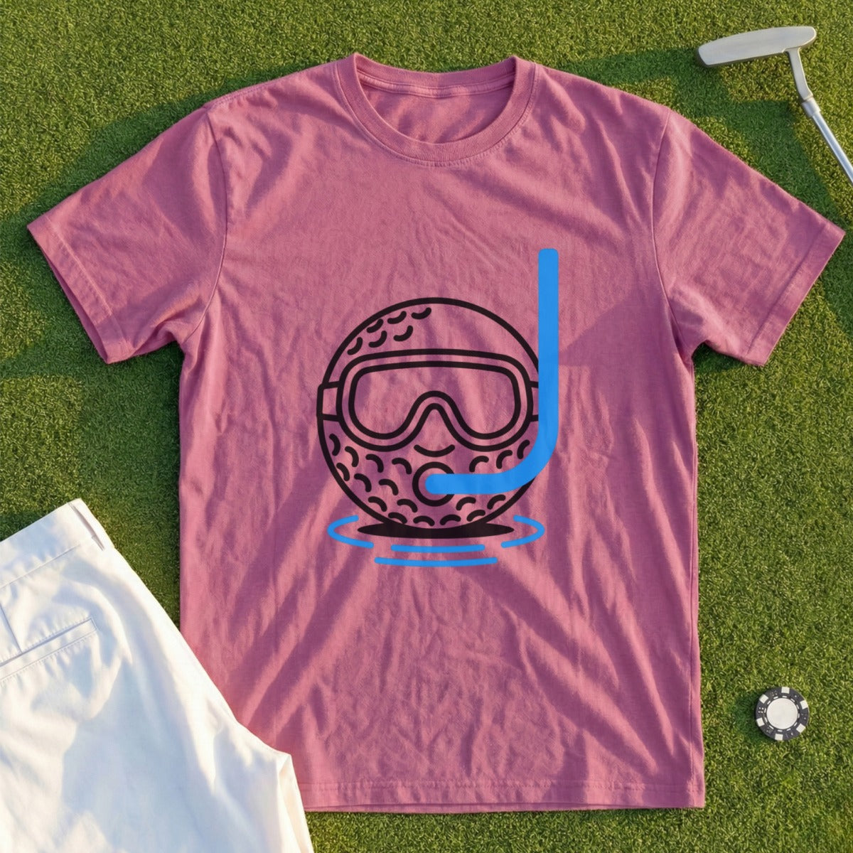 Pink t-shirt with cartoon golf ball wearing a snorkel mask on water.