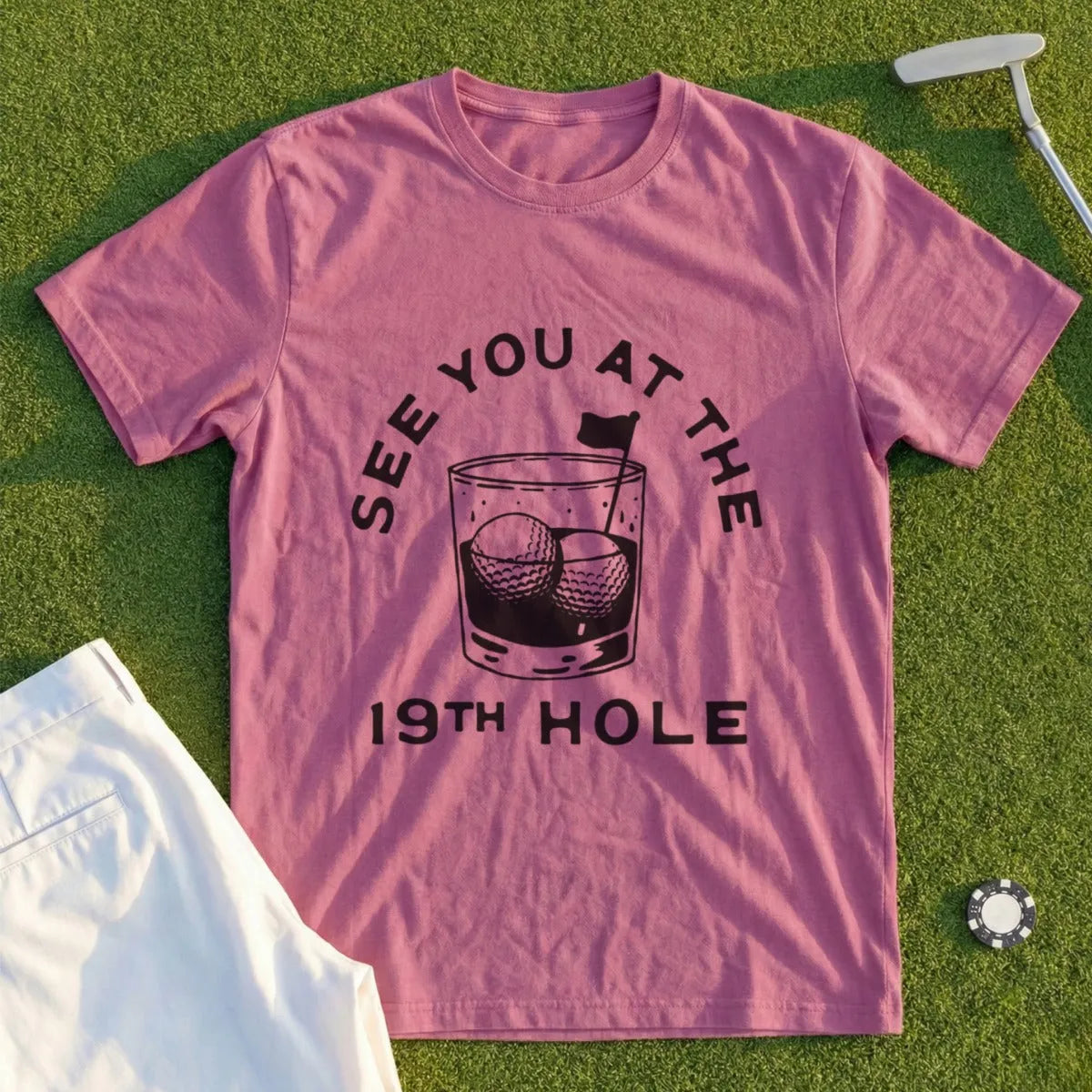 Pink t-shirt with "SEE YOU AT THE 19TH HOLE" and golf ball illustration.