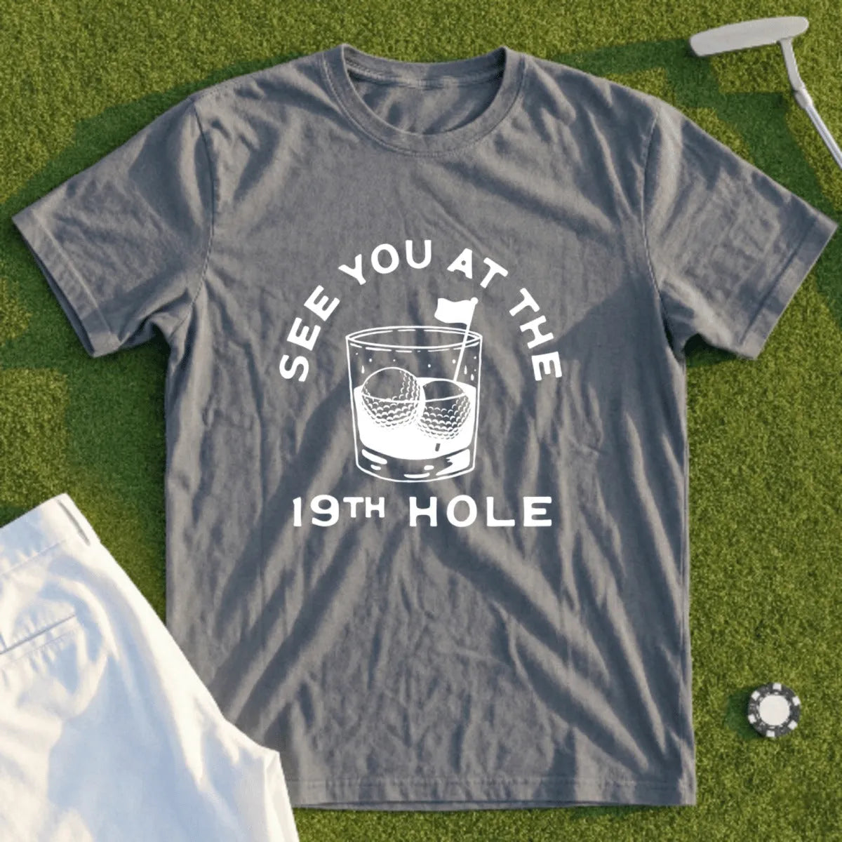 Gray t-shirt with "See You At The 19th Hole" and golf ball ice cube graphic.