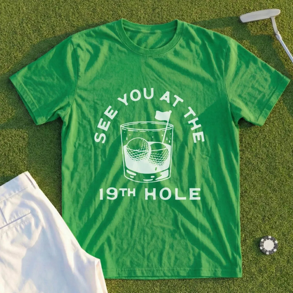 Green t-shirt with "See you at the 19th hole" text and golf ball graphic.