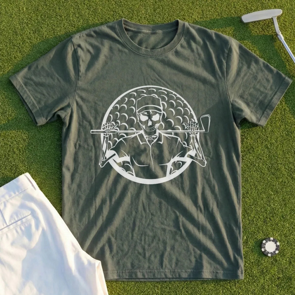 Green t-shirt with a graphic of a skeleton golfer holding clubs on a golf ball.