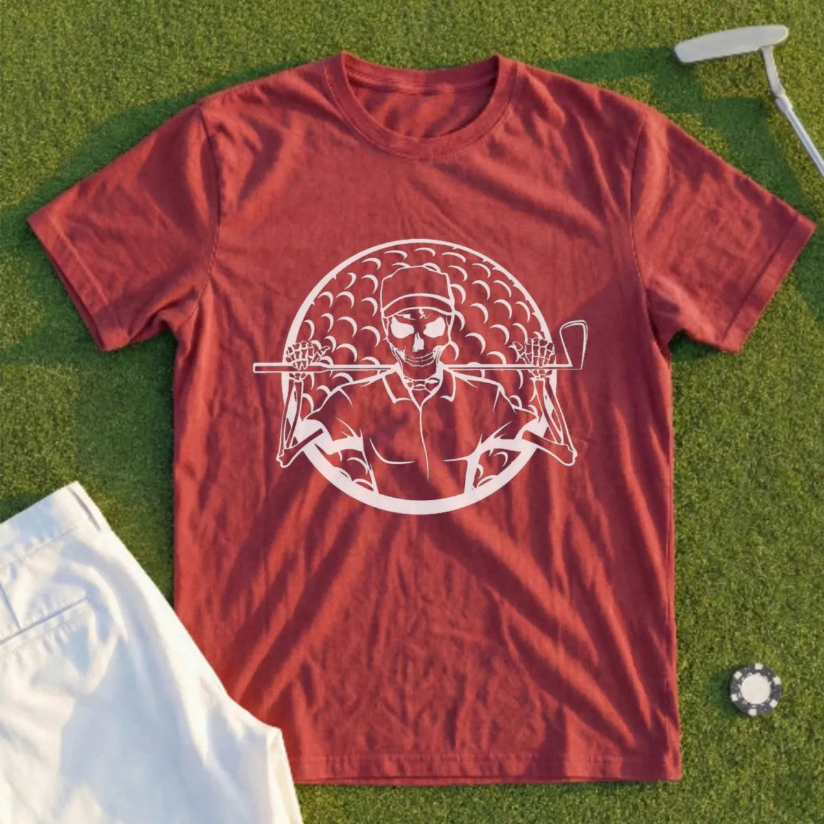 Skeleton golfer with clubs on a red t-shirt.