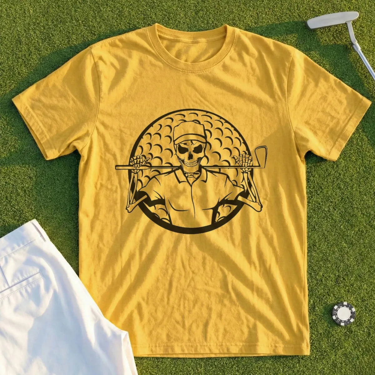 Yellow t-shirt with a skeleton golfer graphic and a golf ball backdrop.