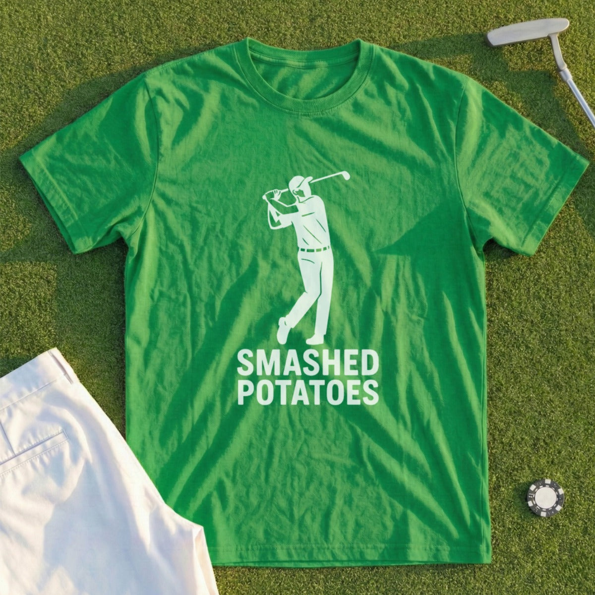 Green t-shirt with white graphic of golfer and text "SMASHED POTATOES".