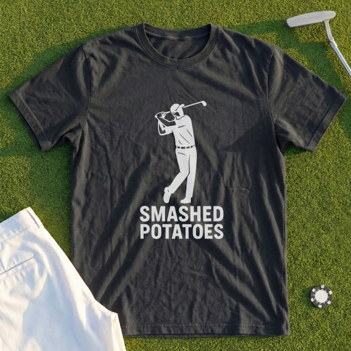 Dark t-shirt with white graphic of golfer and text "SMASHED POTATOES".