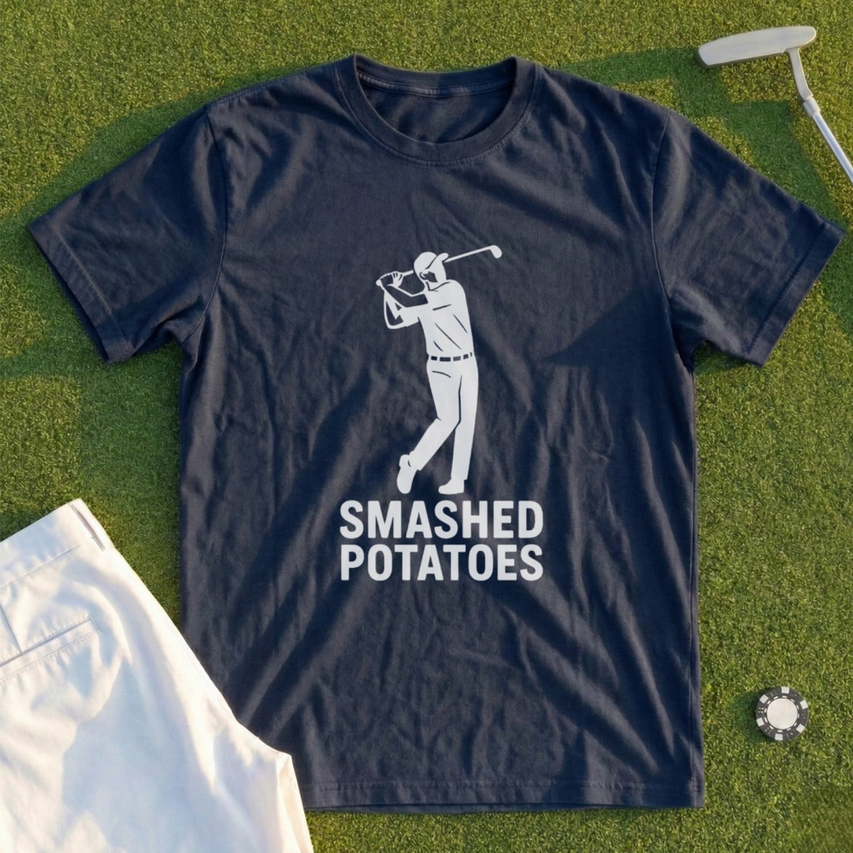 Navy t-shirt with white text and graphic of golfer on green grass.
