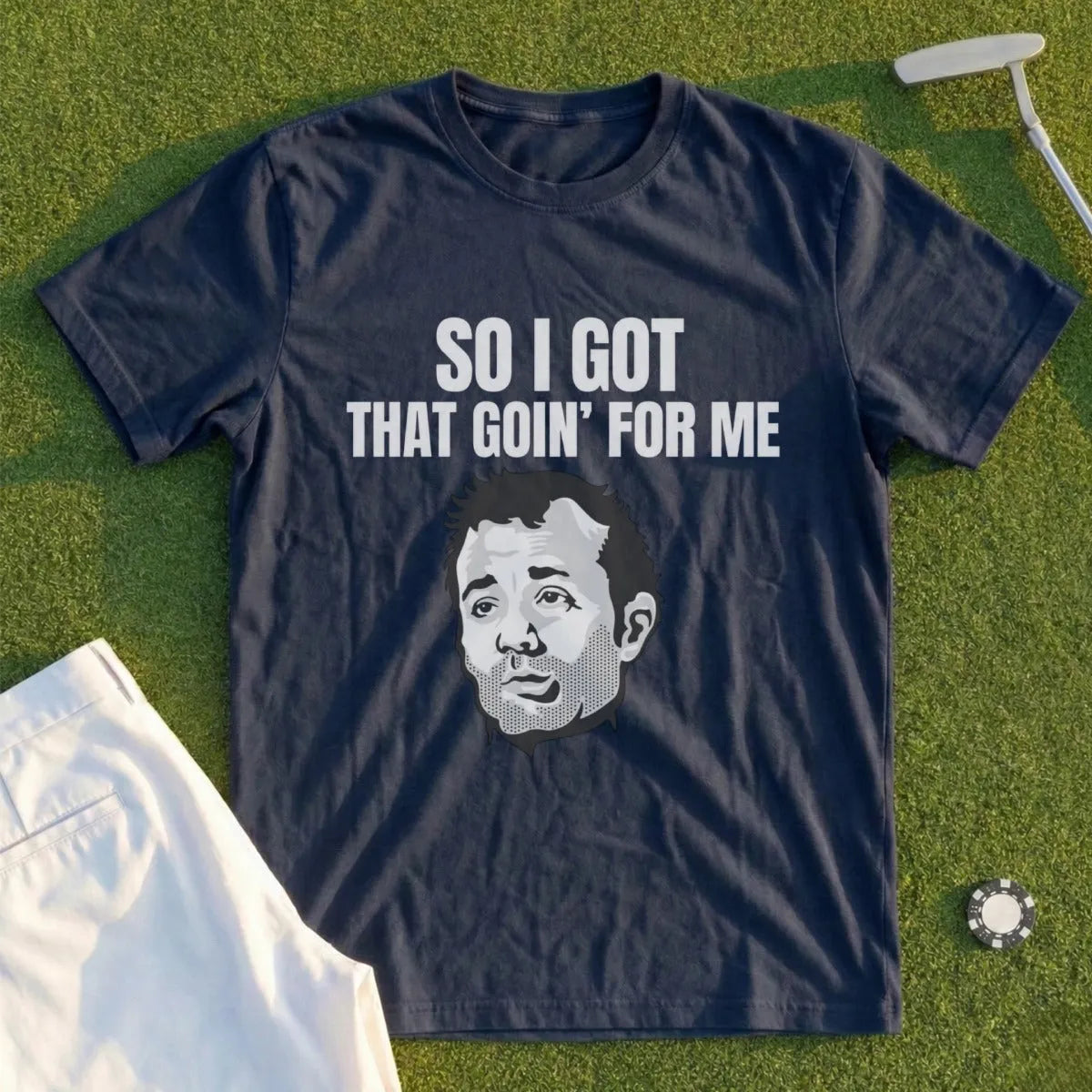 Navy t-shirt with "SO I GOT THAT GOIN' FOR ME" text and a grayscale portrait.