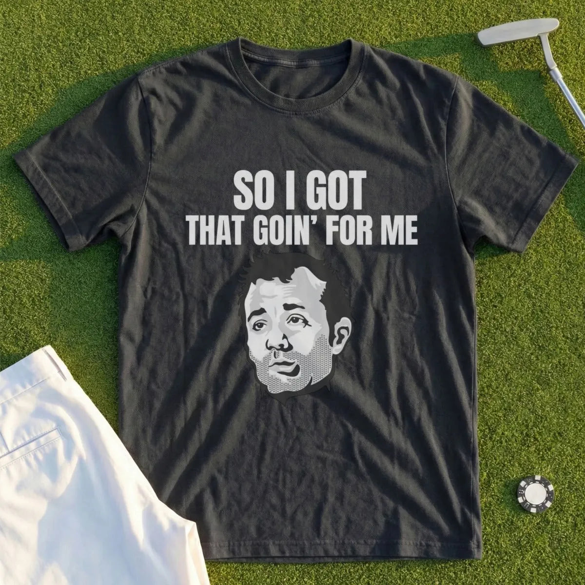 Dark t-shirt with "SO I GOT THAT GOIN' FOR ME" and a man's face.
