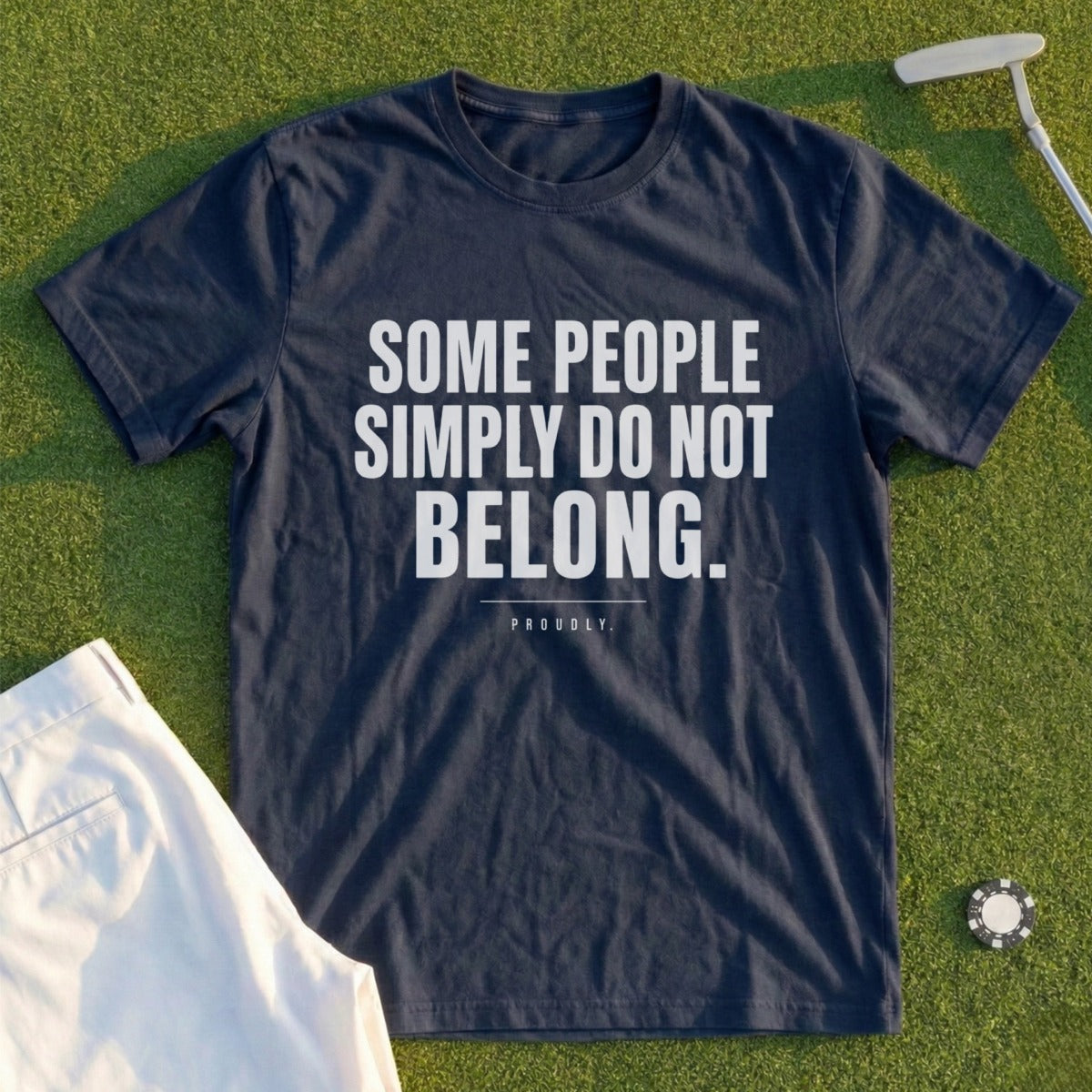 Navy t-shirt with white text reading "SOME PEOPLE SIMPLY DO NOT BELONG. PROUDLY."