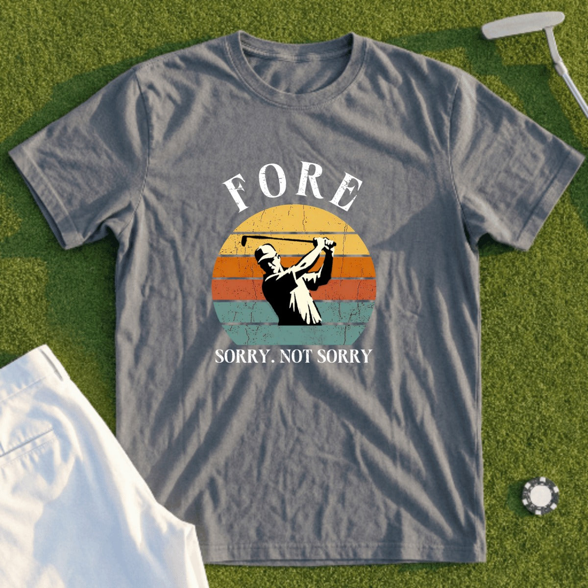 Grey t-shirt with "FORE SORRY. NOT SORRY." and a golfer graphic.