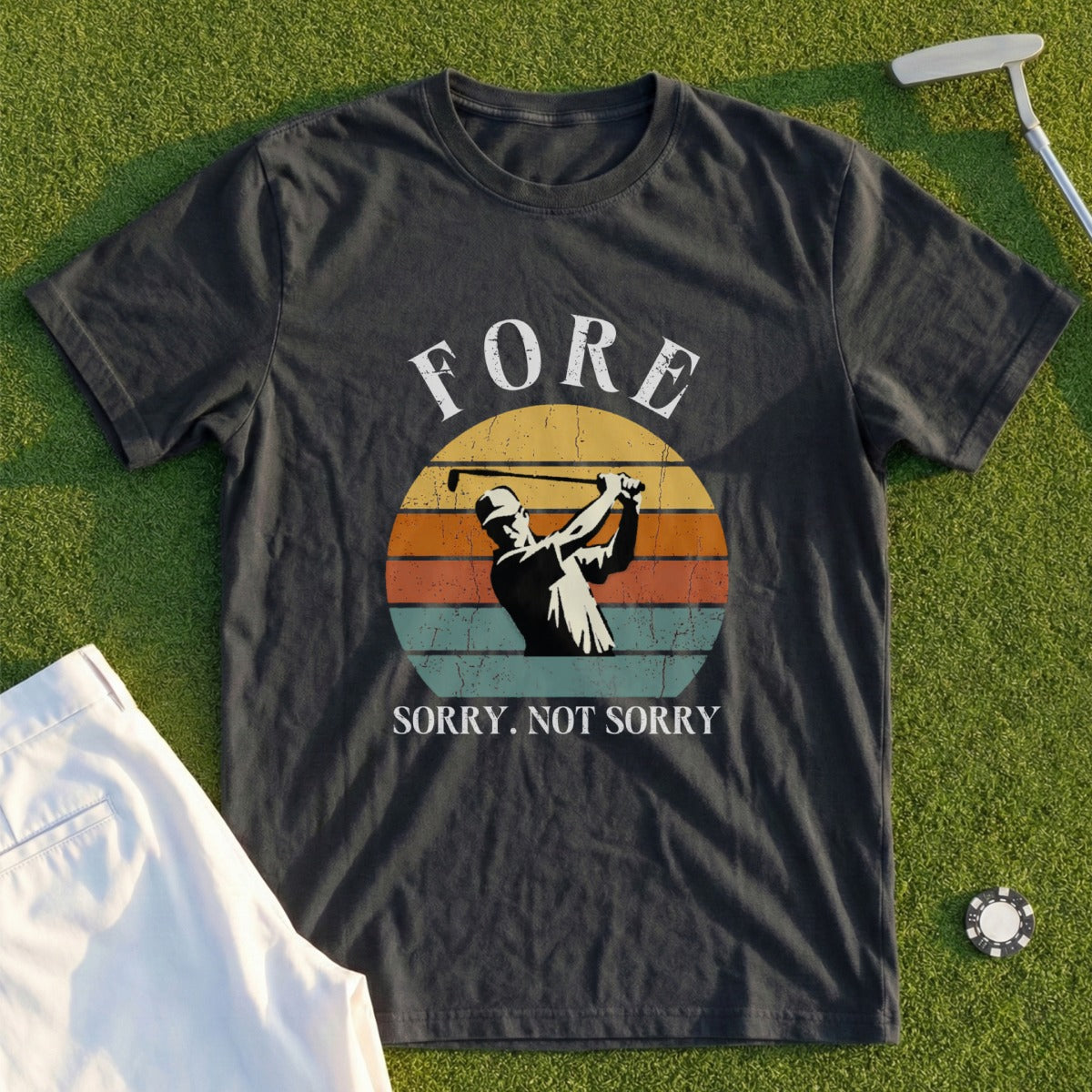 T-shirt with golfer mid-swing and text "FORE SORRY. NOT SORRY."