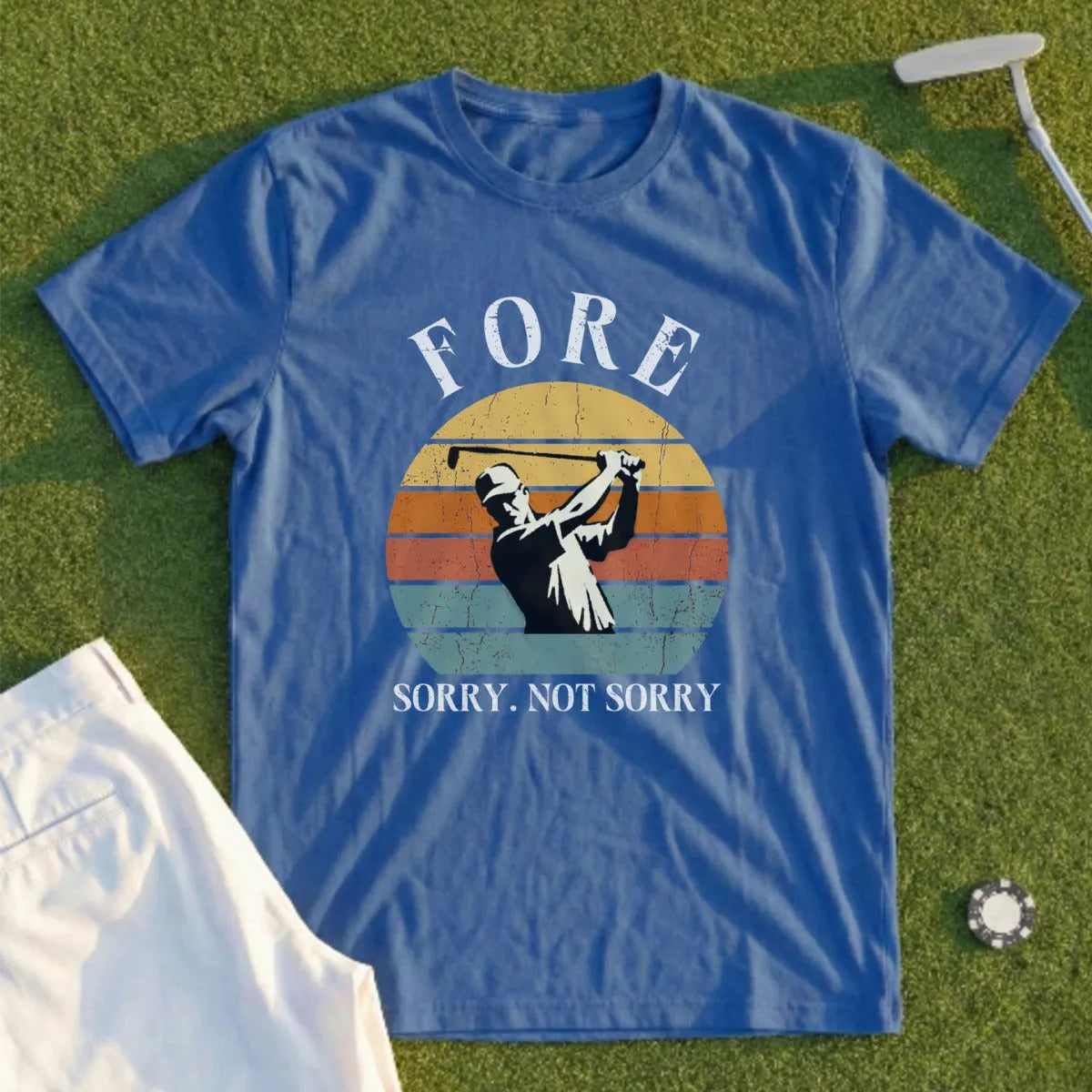Blue t-shirt with golfer silhouette and "FORE SORRY. NOT SORRY." text.