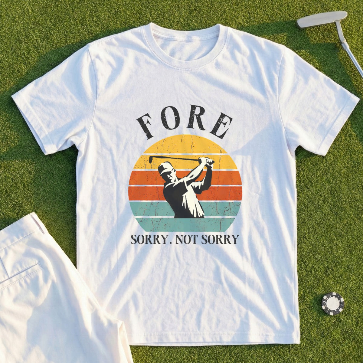 White t-shirt with golfer silhouette and "FORE. SORRY. NOT SORRY." text.