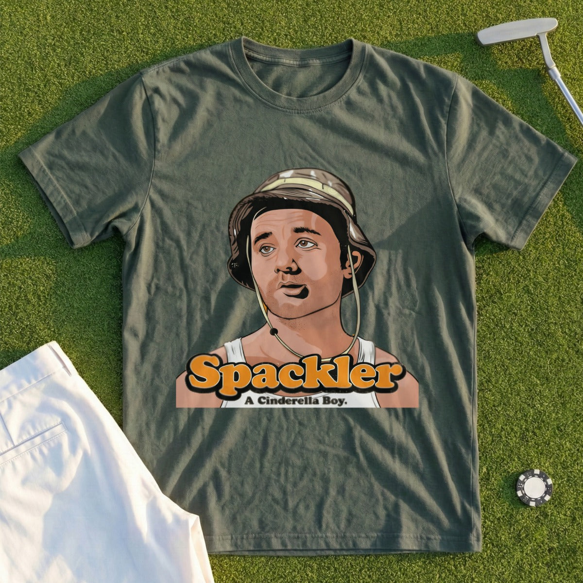 Green t-shirt with "A Cinderella Boy" and a cartoon portrait.