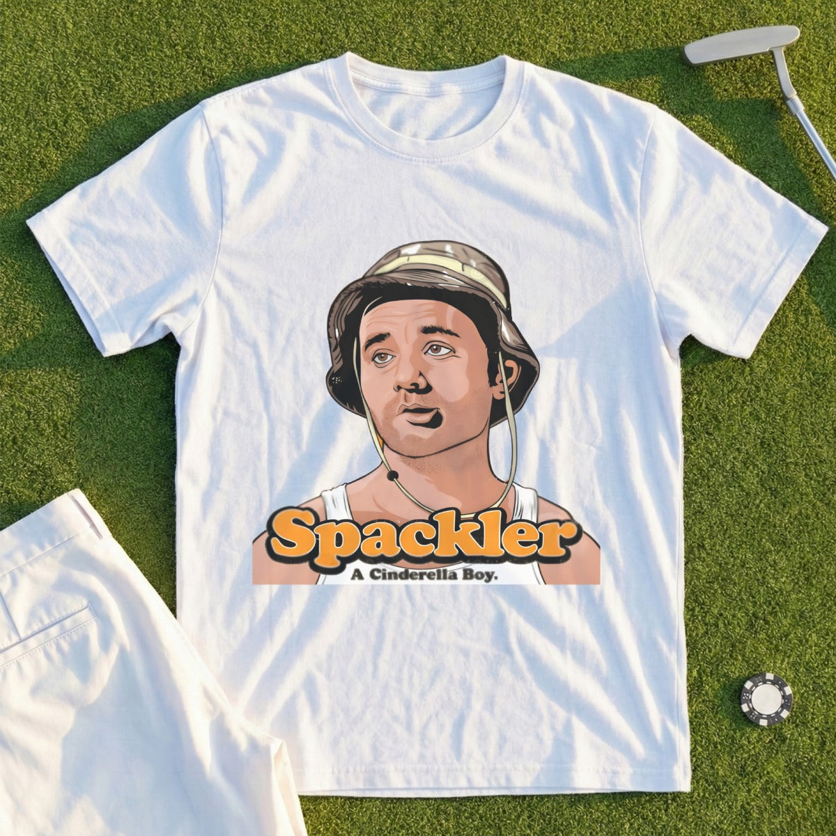 White t-shirt with cartoon character wearing a hat and text "A Cinderella Boy."