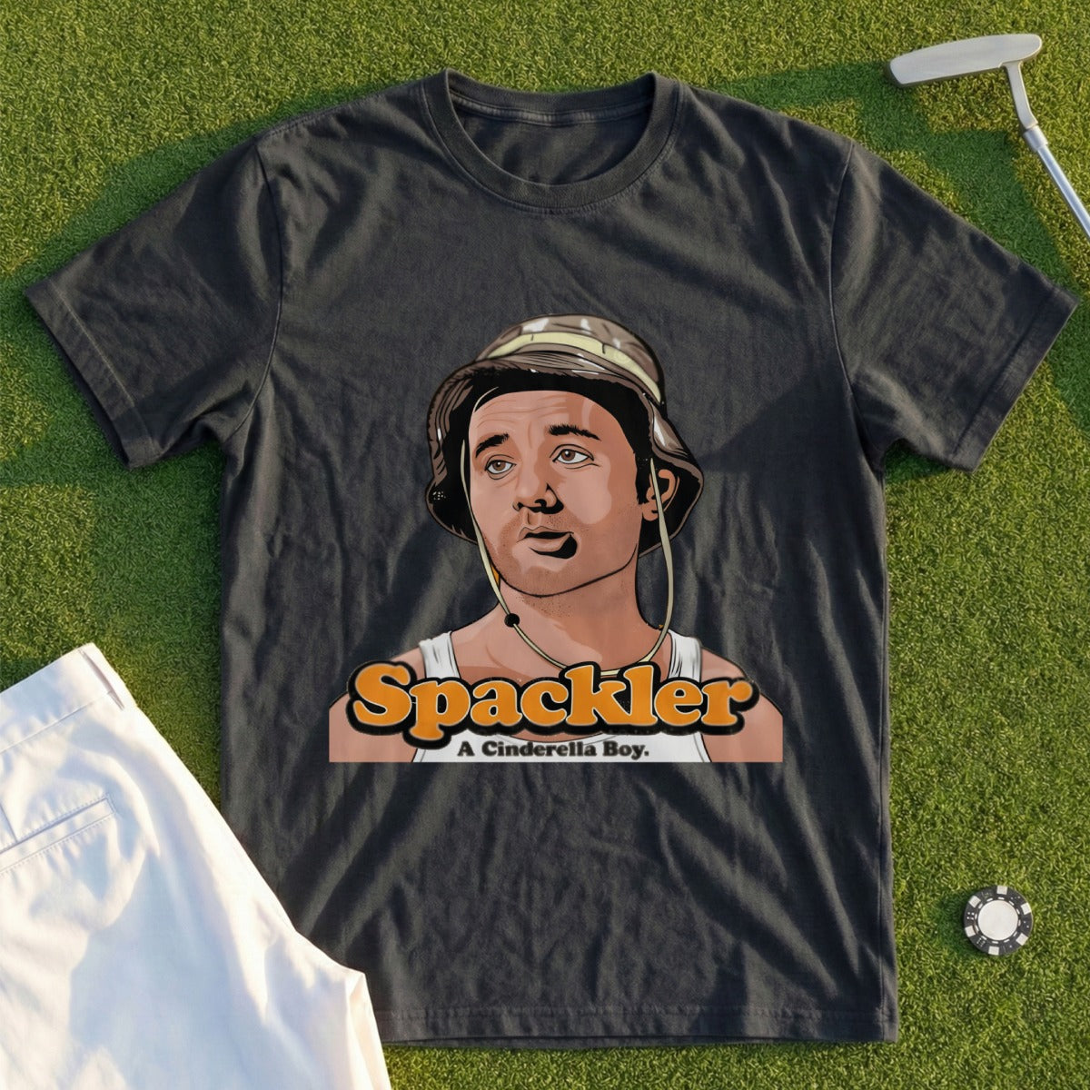 Dark t-shirt with graphic of cartoon character, "A Cinderella Boy" text.