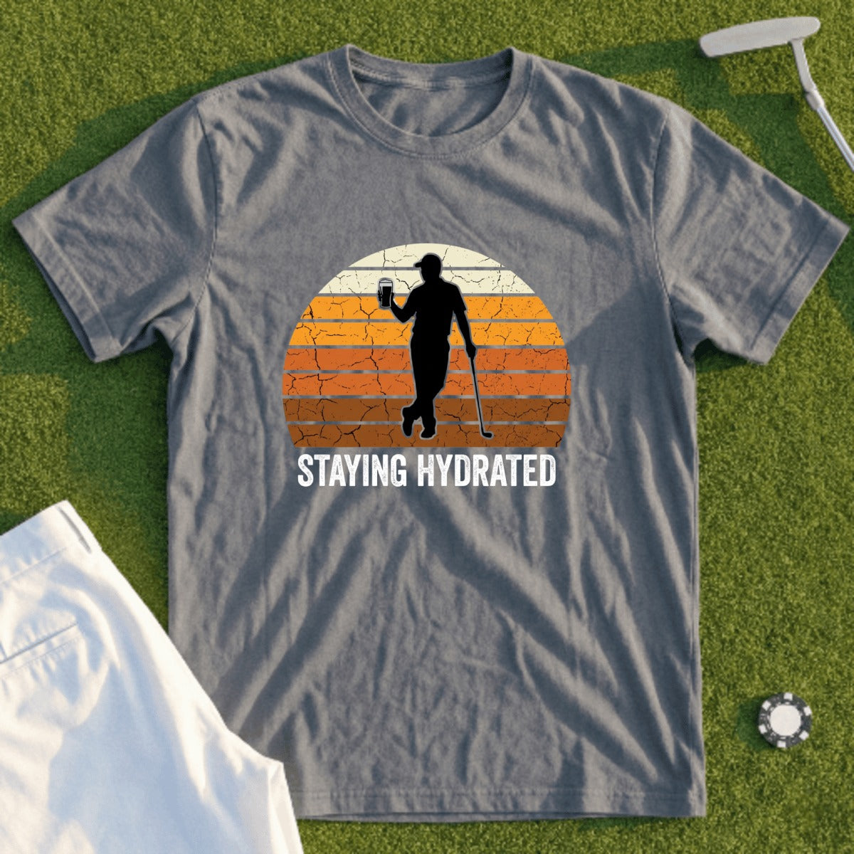 T-shirt with silhouette of golfer holding beer, "STAYING HYDRATED" text.
