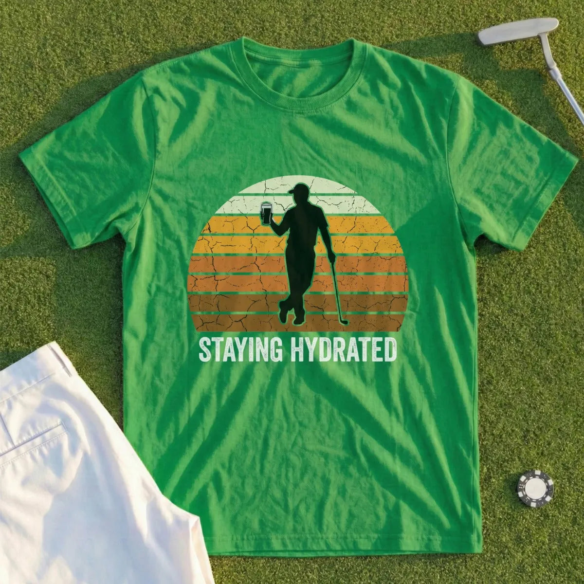 Green t-shirt with golfer silhouette and "Staying Hydrated" text.