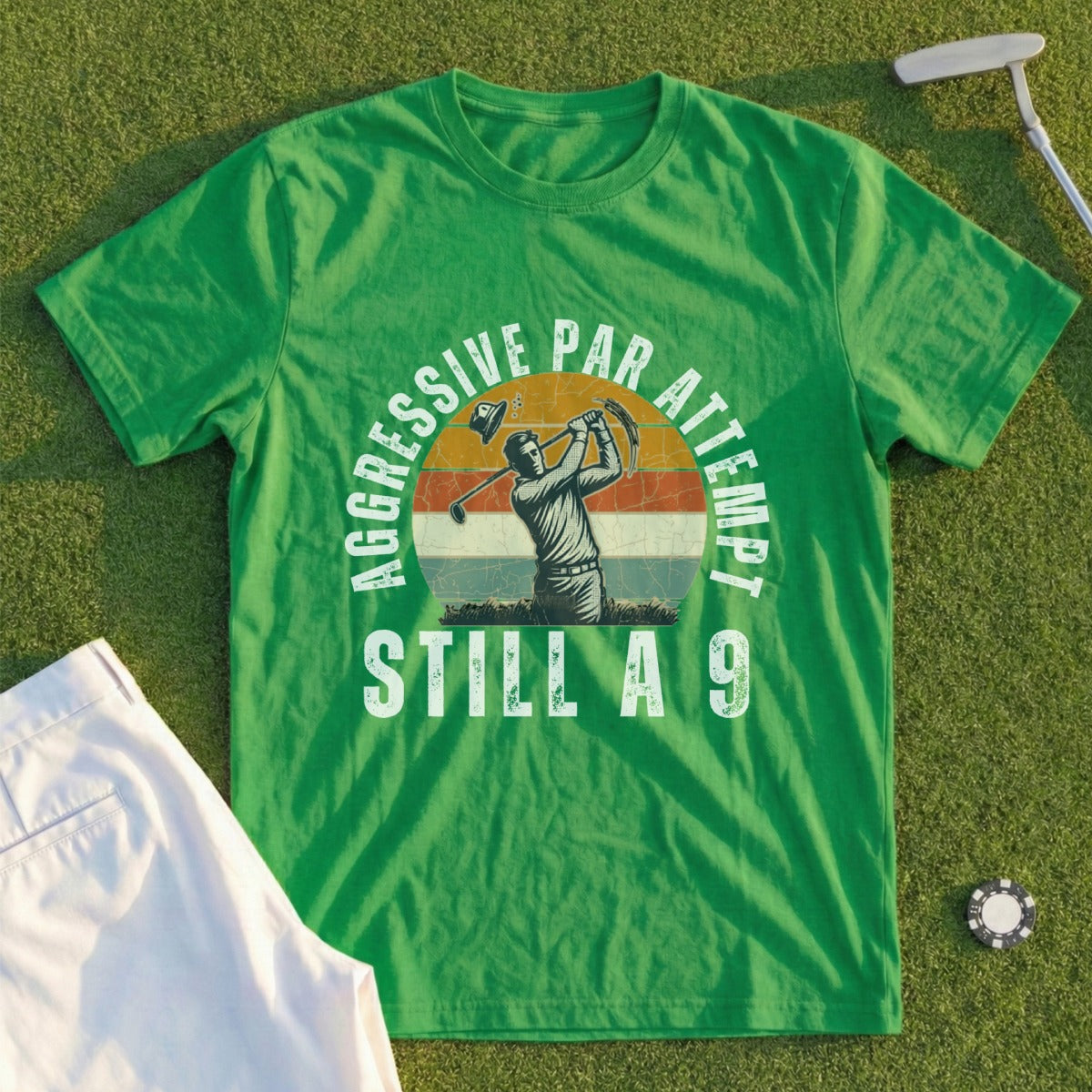 Green t-shirt with "AGGRESSIVE PAR ATTEMPT STILL A 9" and golfer graphic.