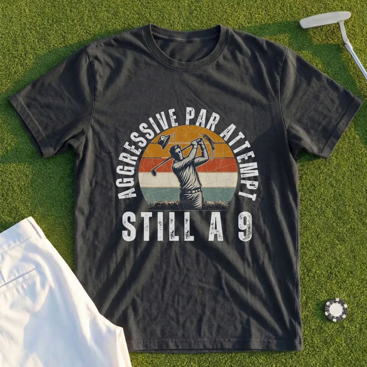 Dark t-shirt with "AGGRESSIVE PAR ATTEMPT STILL A 9" and golfer graphic.