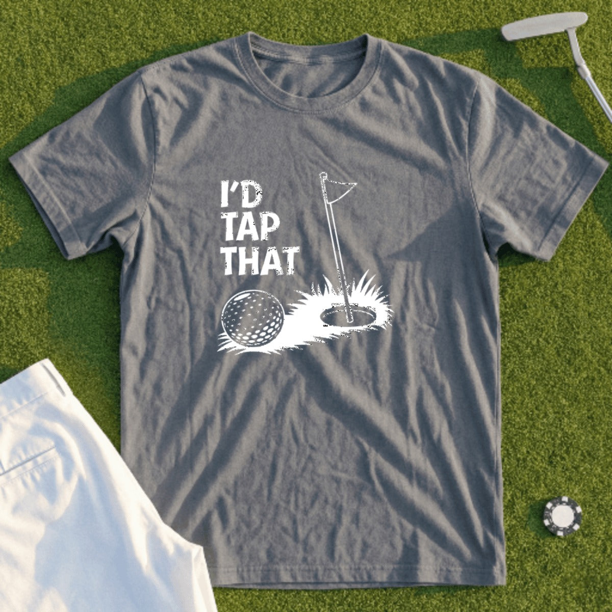 Golf t-shirt with "I'd Tap That" slogan and golf ball at hole.