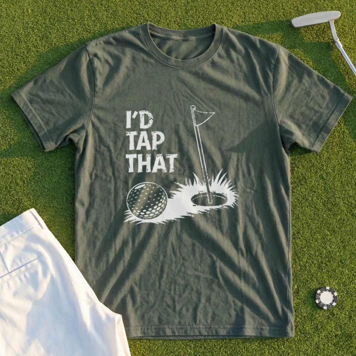 Olive green t-shirt with "I'd tap that" text, golf ball, and hole.