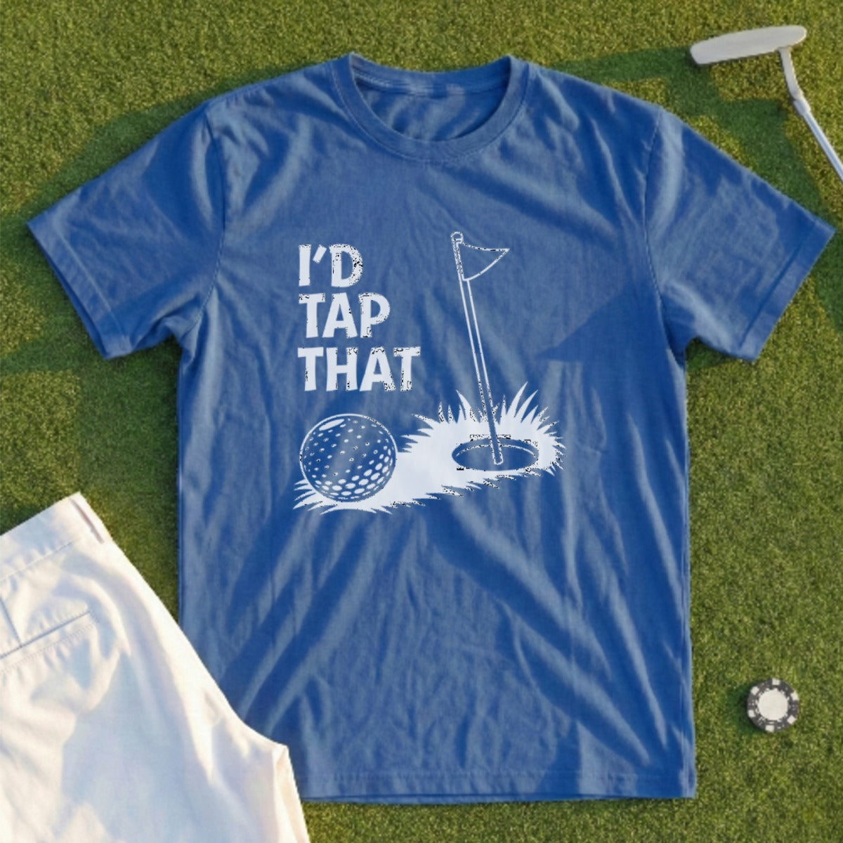 Blue t-shirt with golf design: "I'd Tap That" text, golf ball, hole, and flag.