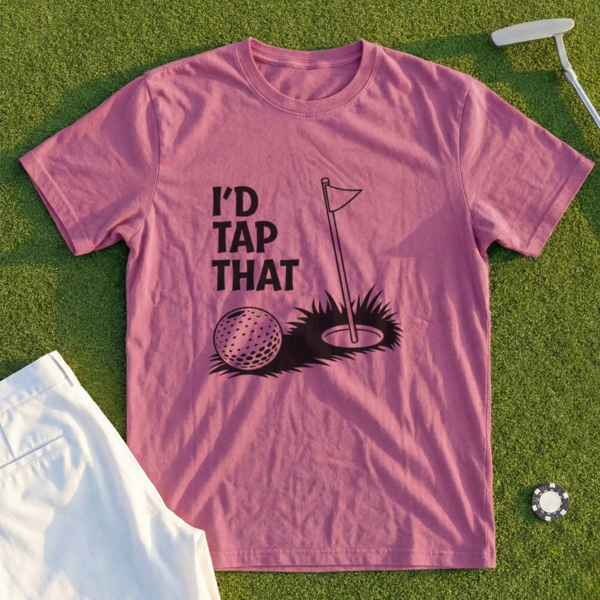 "I'd Tap That" text on a pink t-shirt with a golf ball and hole.