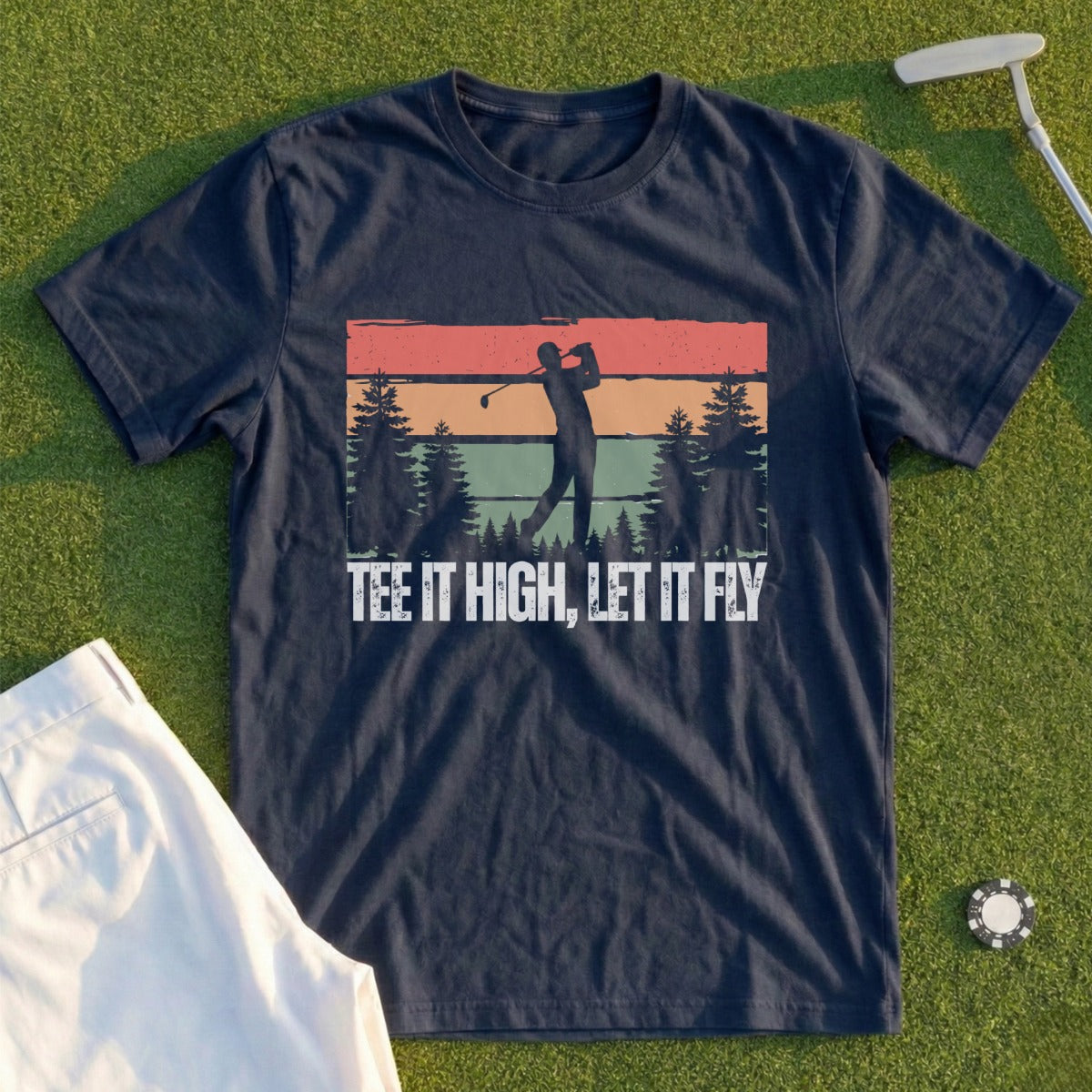 Navy t-shirt with golfer and sunset graphic, "Tee it high, let it fly."
