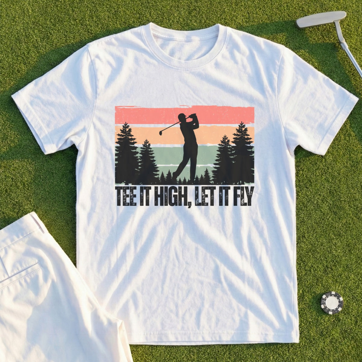 White t-shirt with graphic of golfer and text "TEE IT HIGH, LET IT FLY."