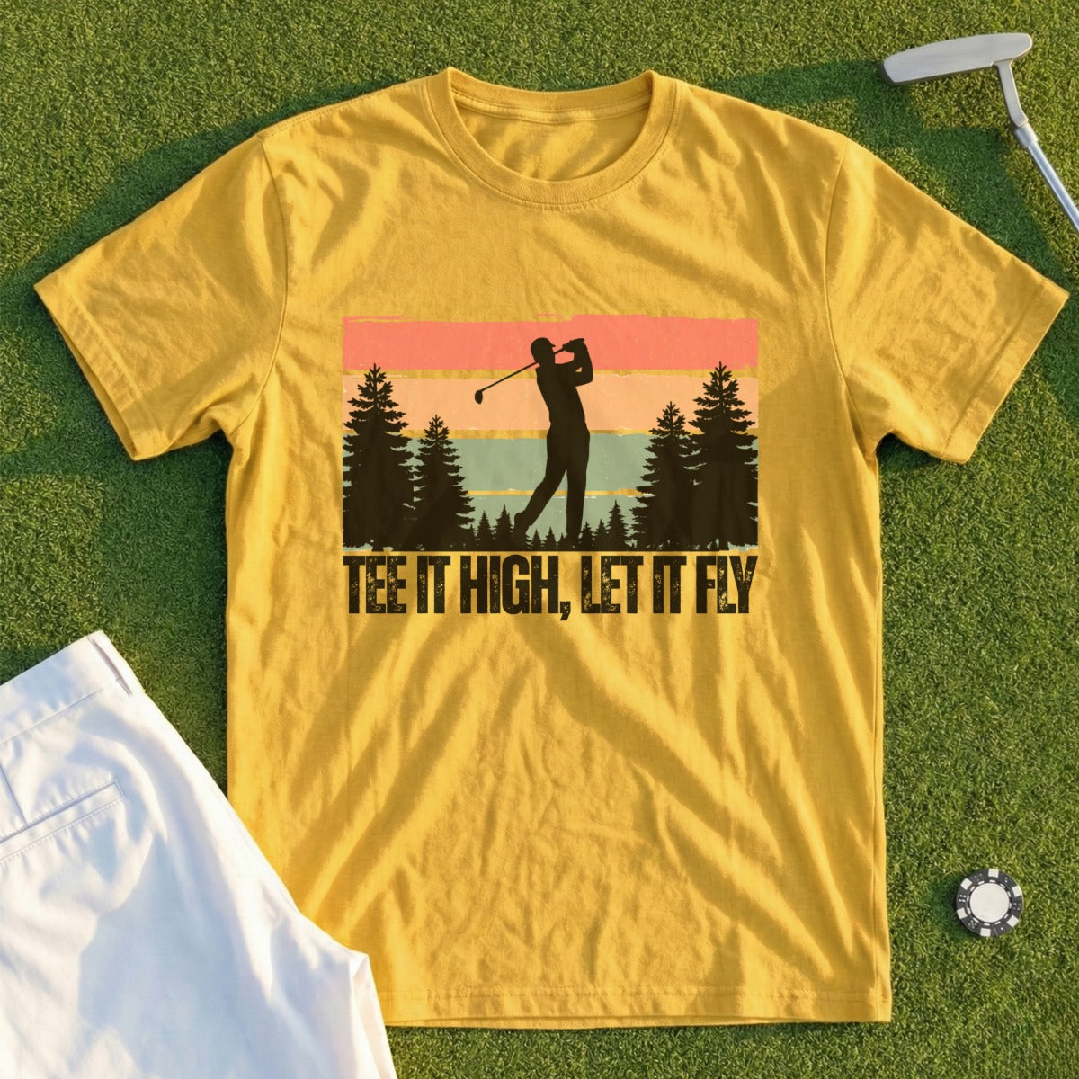 Yellow t-shirt with graphic of golfer teeing off, text "TEE IT HIGH, LET IT FLY".