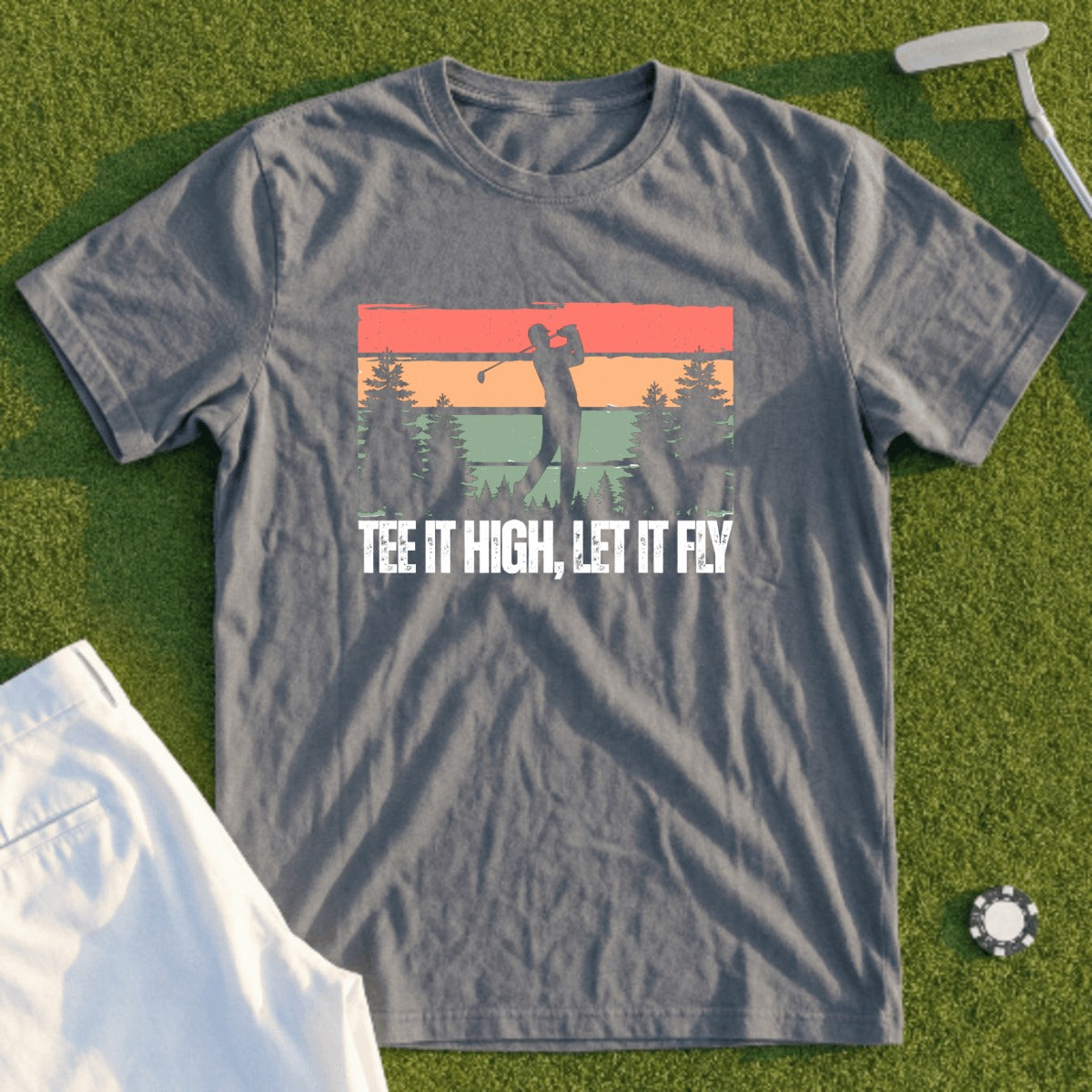Gray t-shirt with a sunset golf scene and text "Tee it high, let it fly."