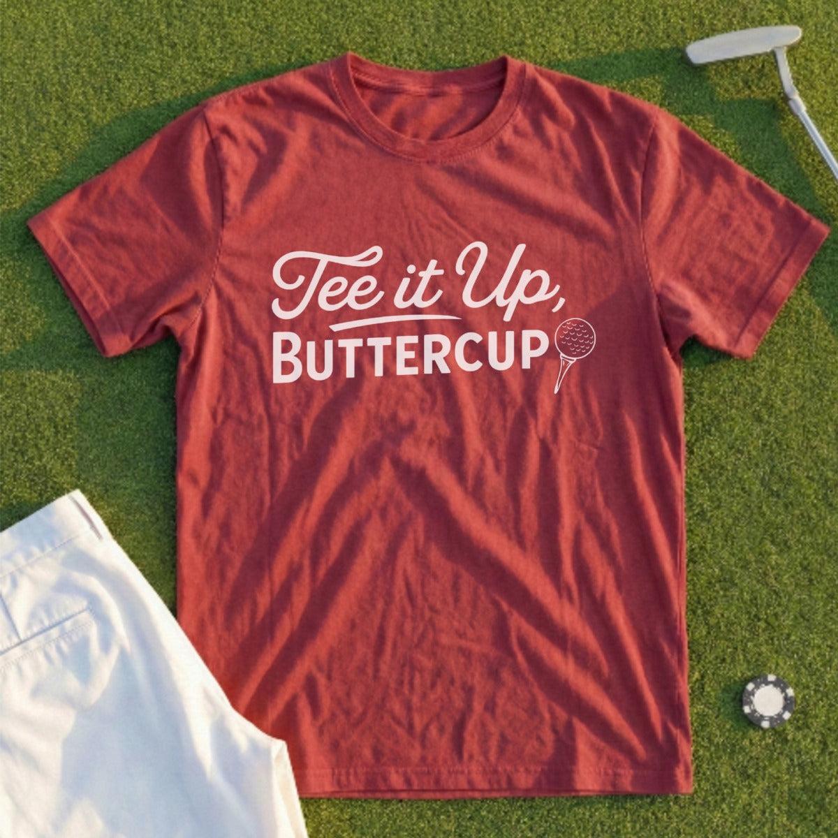 Maroon t-shirt with "Tee it Up, Buttercup" text and a golf ball graphic.