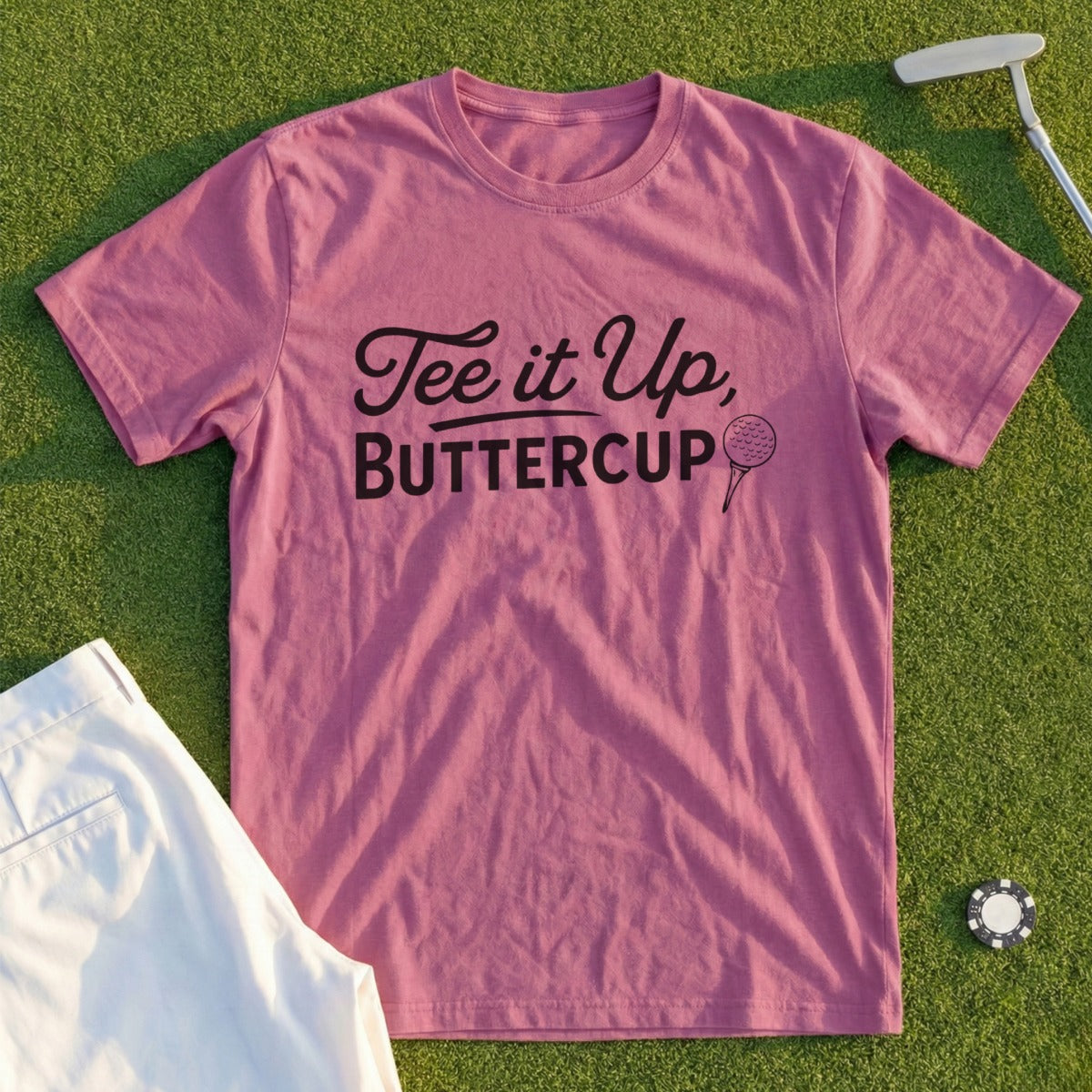 Pink t-shirt with "Tee It Up, Buttercup" text and golf ball graphic.