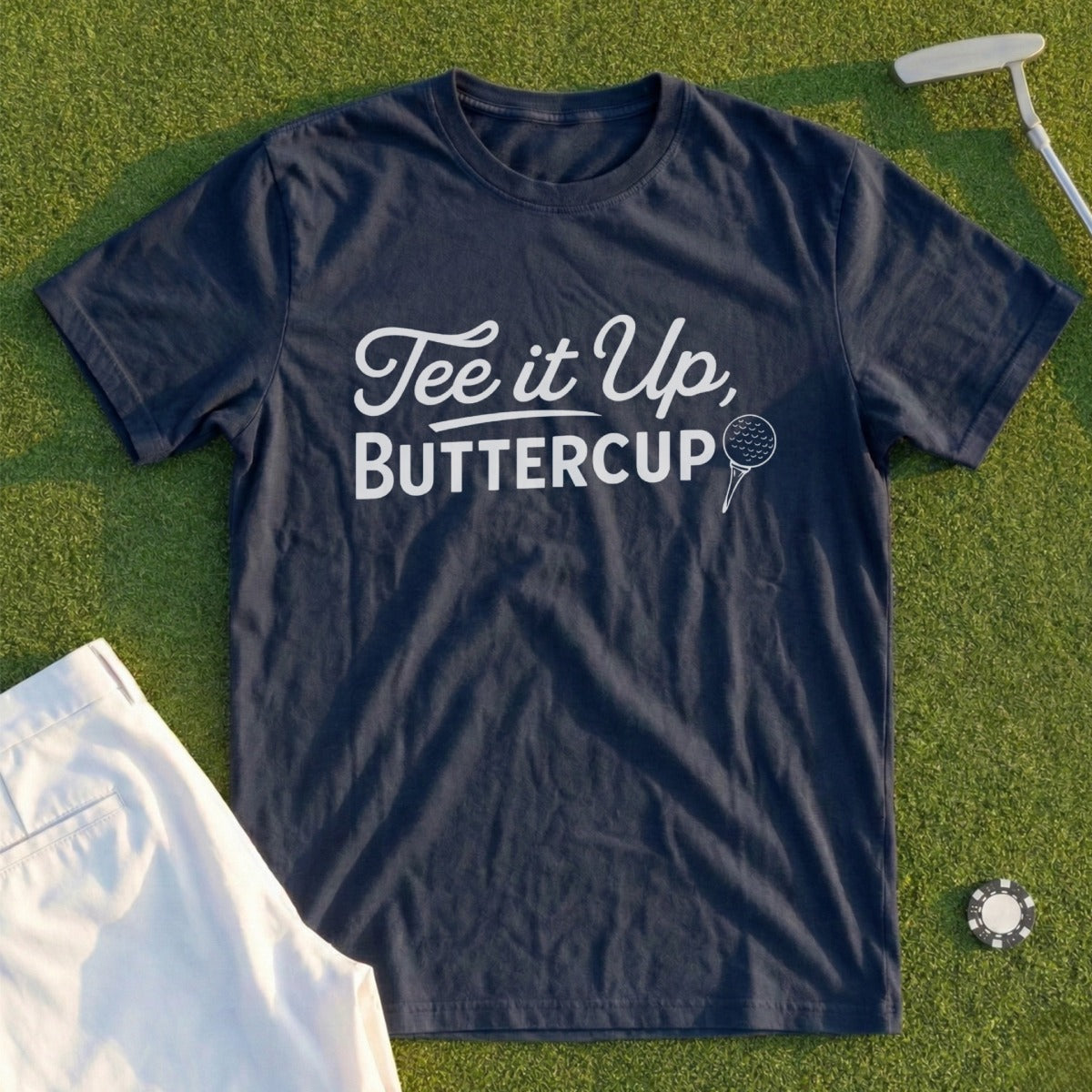 Navy t-shirt with "Tee it up, Buttercup" text and golf ball graphic.