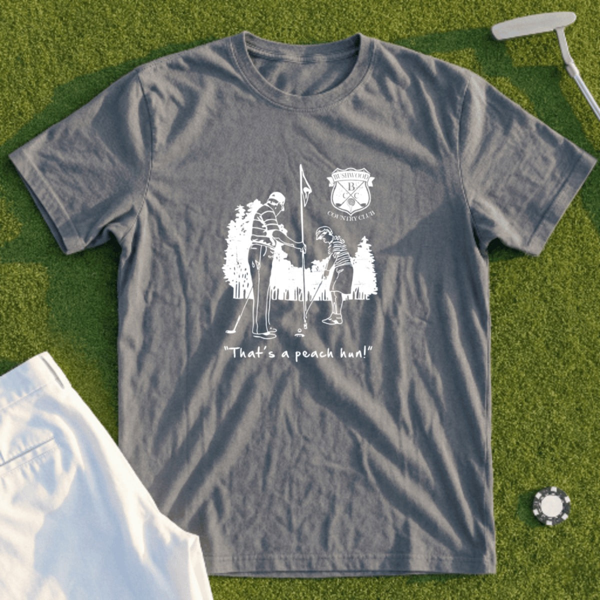 T-shirt with graphic of two golfers and text "That's a peach, man!"