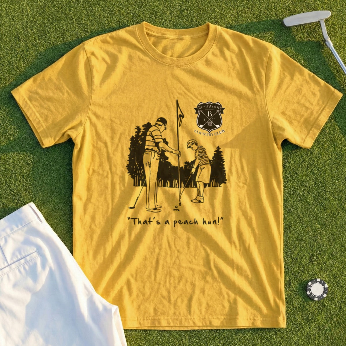 Yellow t-shirt with golf illustration and "That's a peach, hon!" text.