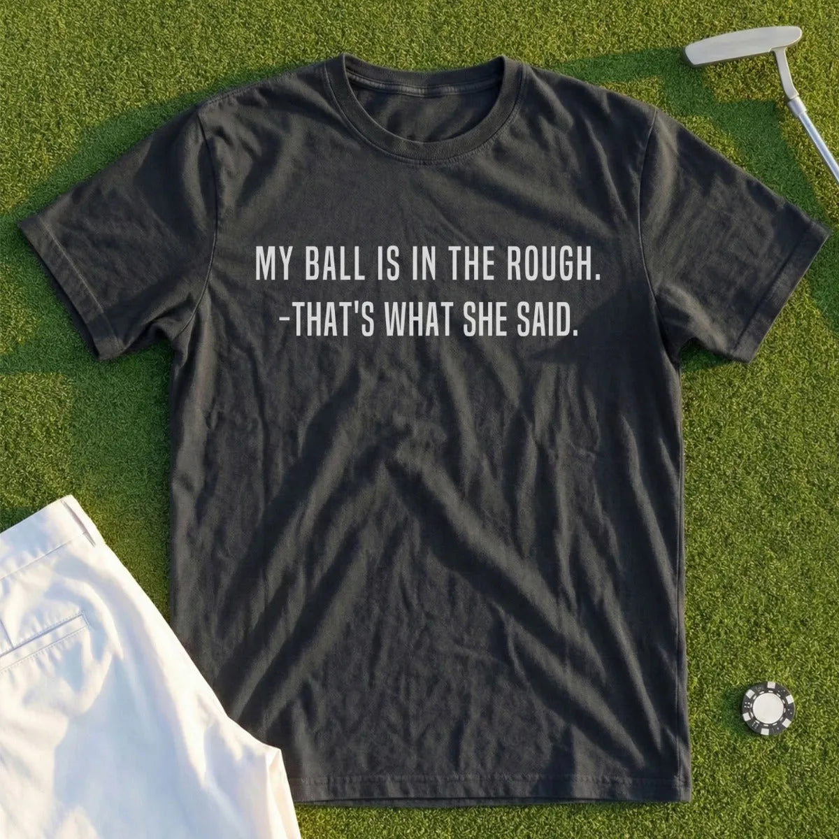 Dark gray t-shirt with white text: "MY BALL IS IN THE ROUGH. -THAT'S WHAT SHE SAID."