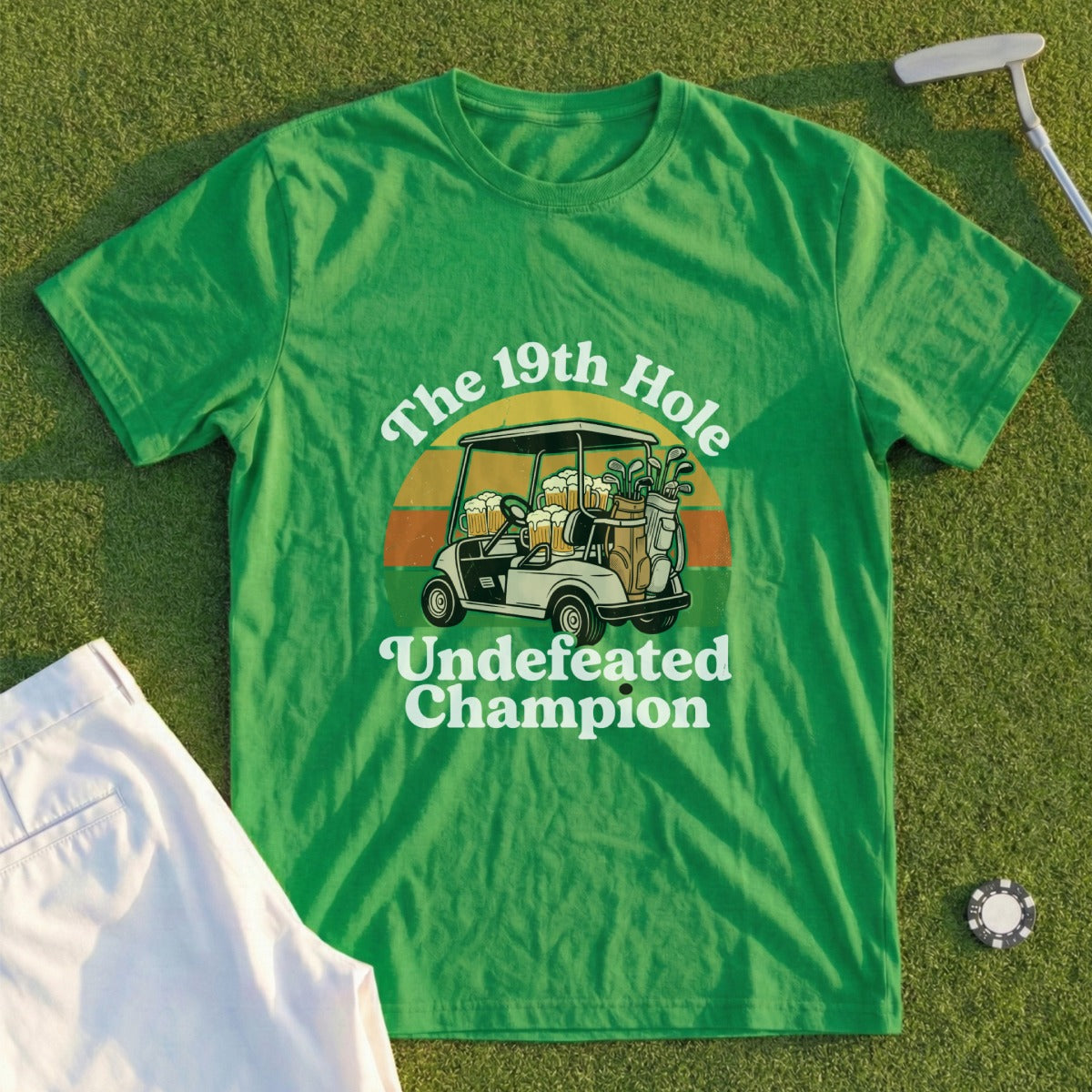 Green t-shirt with "The 19th Hole Undefeated Champion" and golf cart graphic.